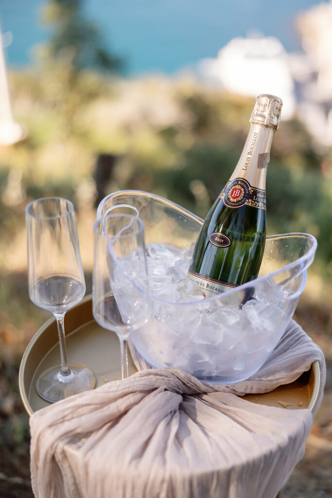 Champagne and two glasses styled for a proposal.