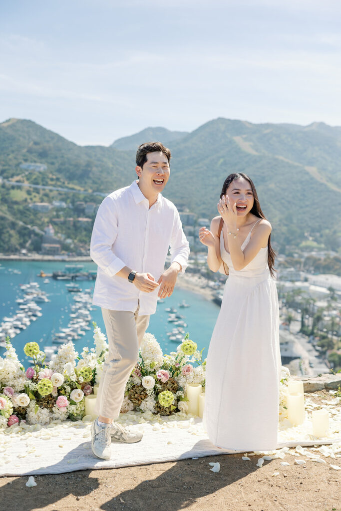 Couple laughing during their Catalina Island proposal at Lee’s Scenic Overlook.