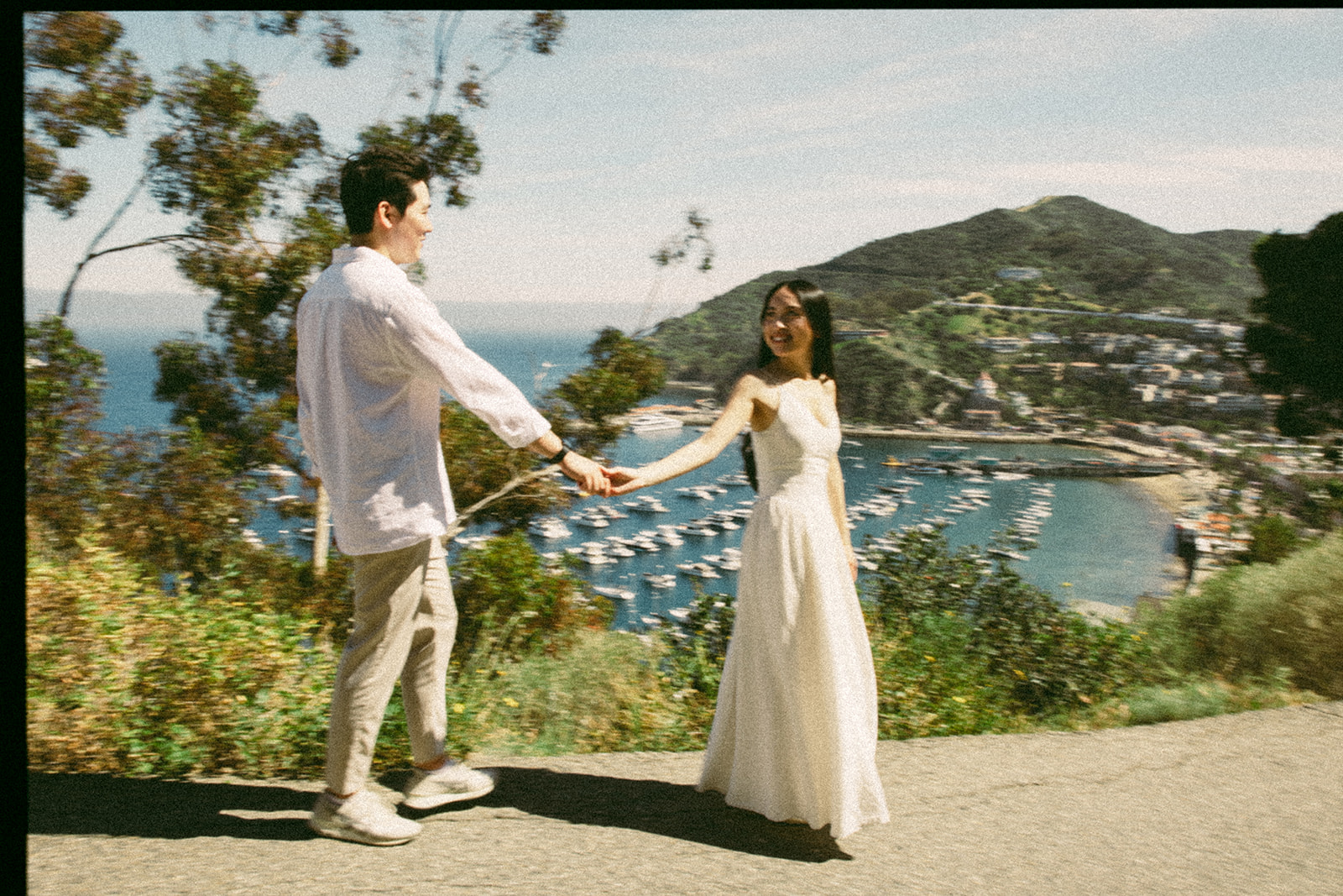 Film photo of a couple walking on Catalina Island during their proposal.