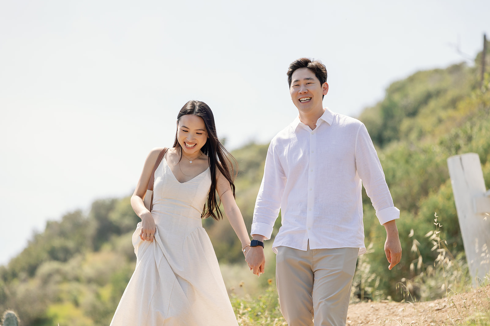 Couple walking down to the proposal spot.