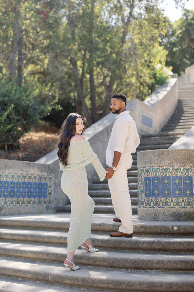 Couple walking up the stairs for their Catalina Island engagement photos at Wrigley Memorial & Botanic Garden.