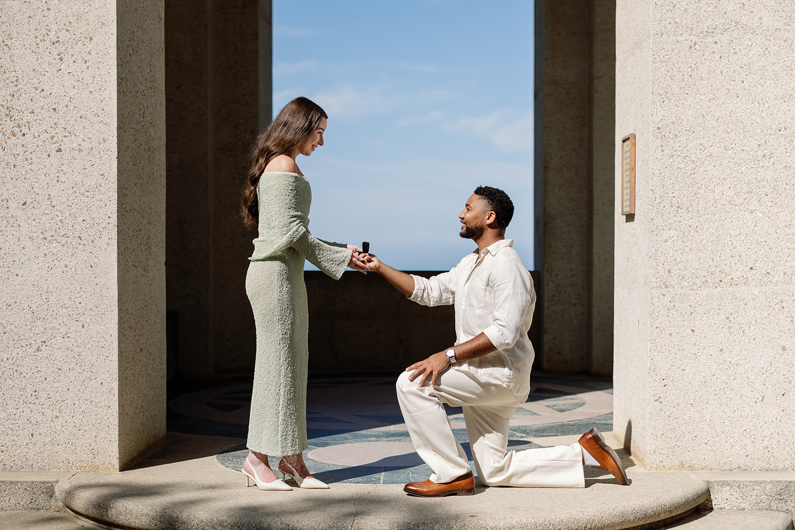 Man kneeling on one knee during his Catalina Island proposal at Wrigley Memorial & Botanic Garden.