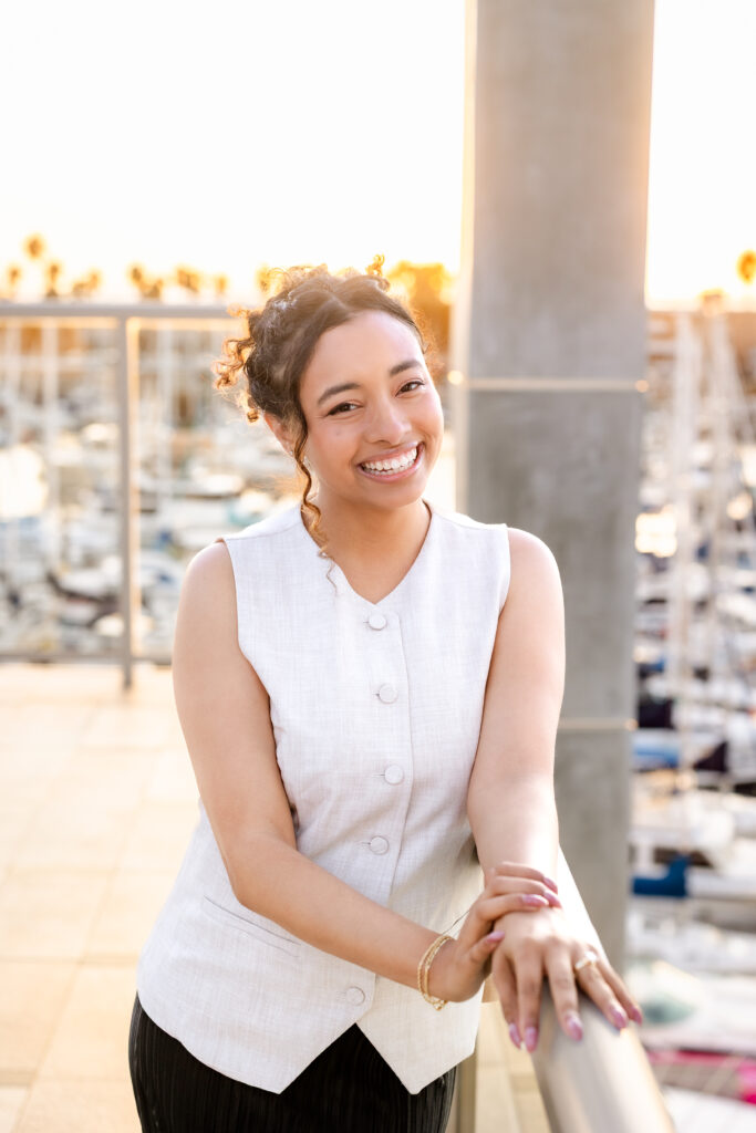 Nicole, owner of Nicole and Photo and a Catalina Proposal Photography posing for a brand photo during golden hour.