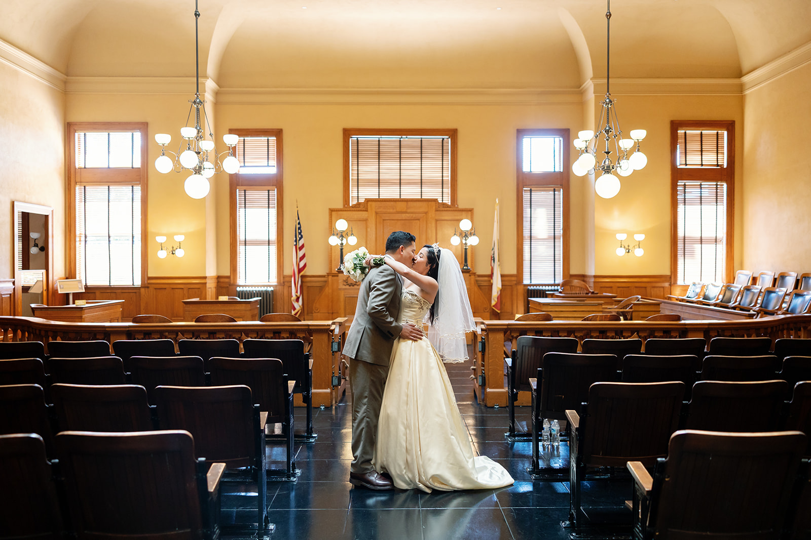 Bride and groom kissing in the historic courthouse at the Old Orange County Courthouse.