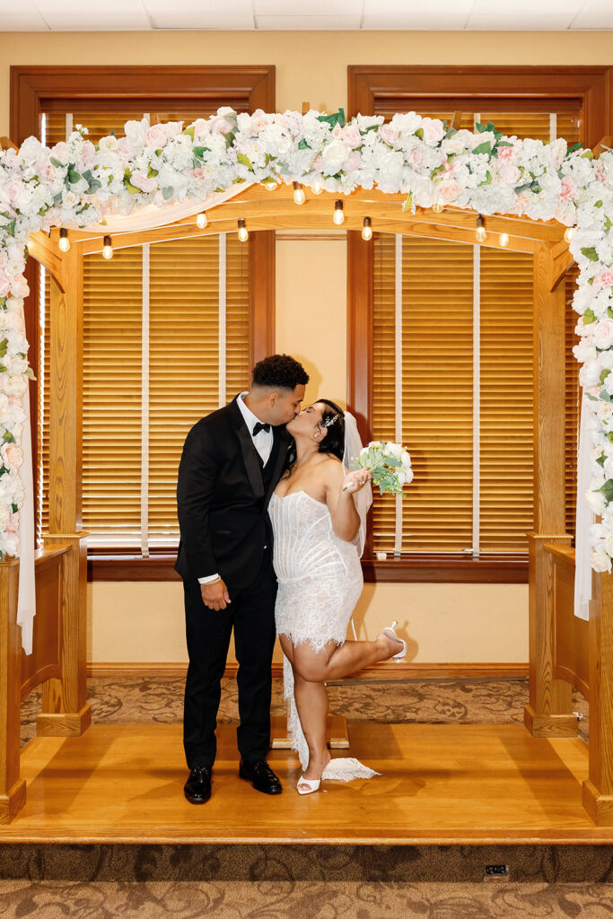 Bride and groom kissing during their Old Orange County Courthouse wedding in Room A in Santa Ana, California.