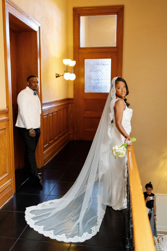 Bride and groom posing upstairs during their Old Orange County Courthouse in Santa Ana, California.